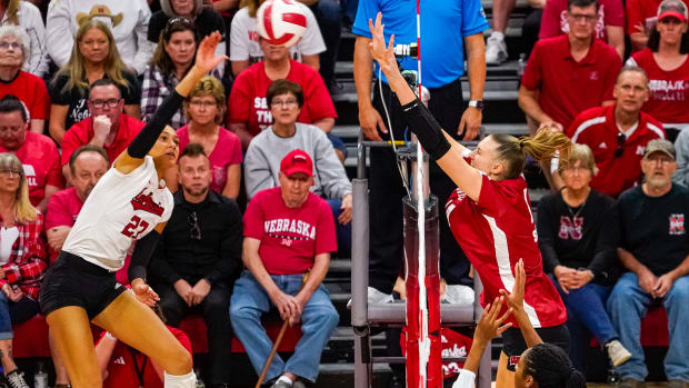 Oct 21, 2023; Lincoln, NE, USA; Wisconsin Badgers middle blocker Anna Smrek (14) attempts to block Nebraska Cornhuskers outside hitter Harper Murray (27) during the fourth set at the Bob Devaney Sports Center. Mandatory Credit: Dylan Widger-USA TODAY Sports